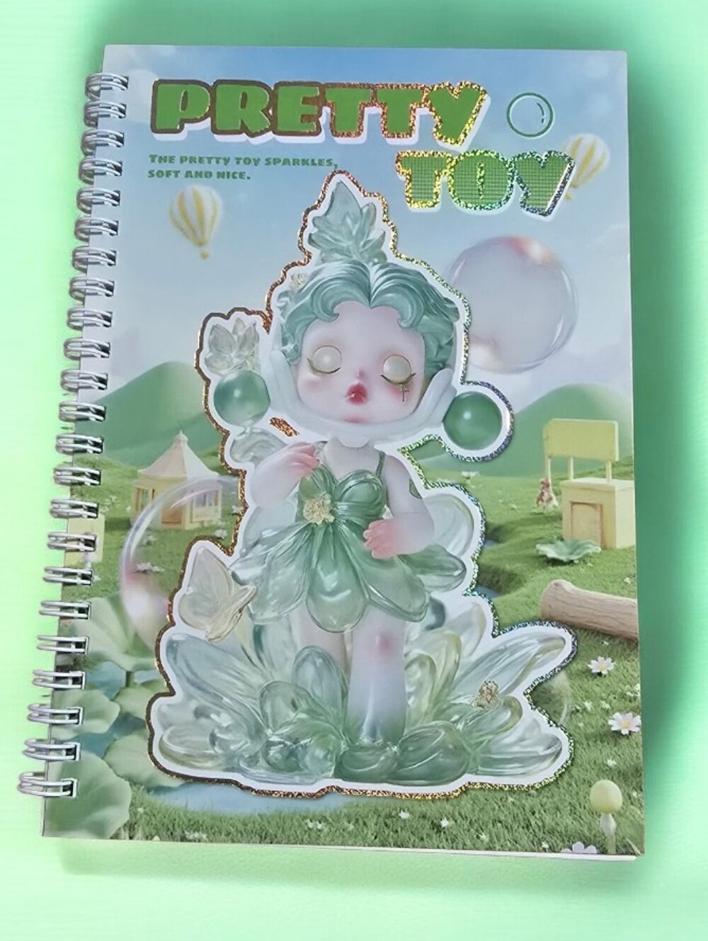 Pretty Toy Spiral Notebook - Green Cover
